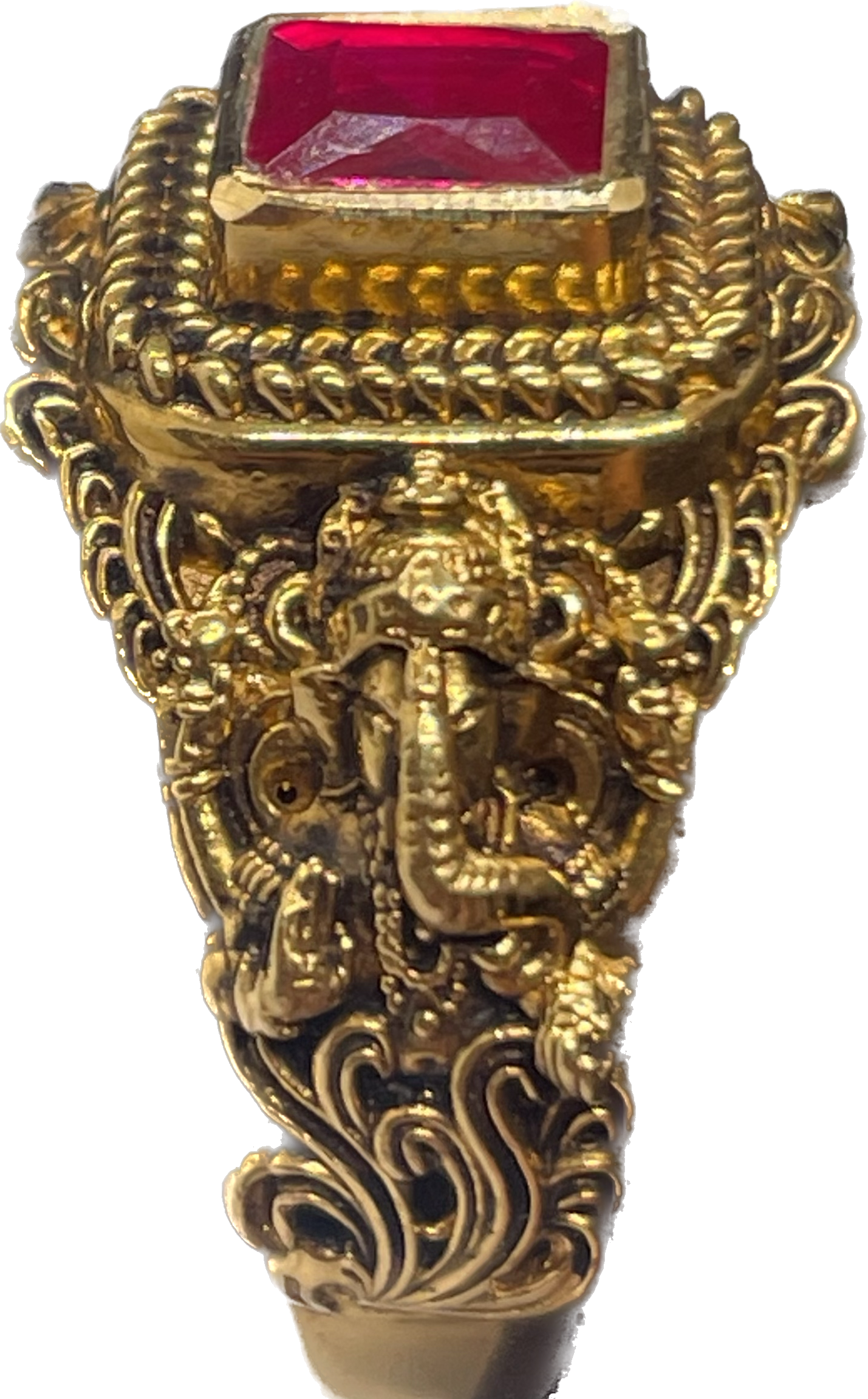 An ornate ring with a rectangular red stone and sculpted detailing.